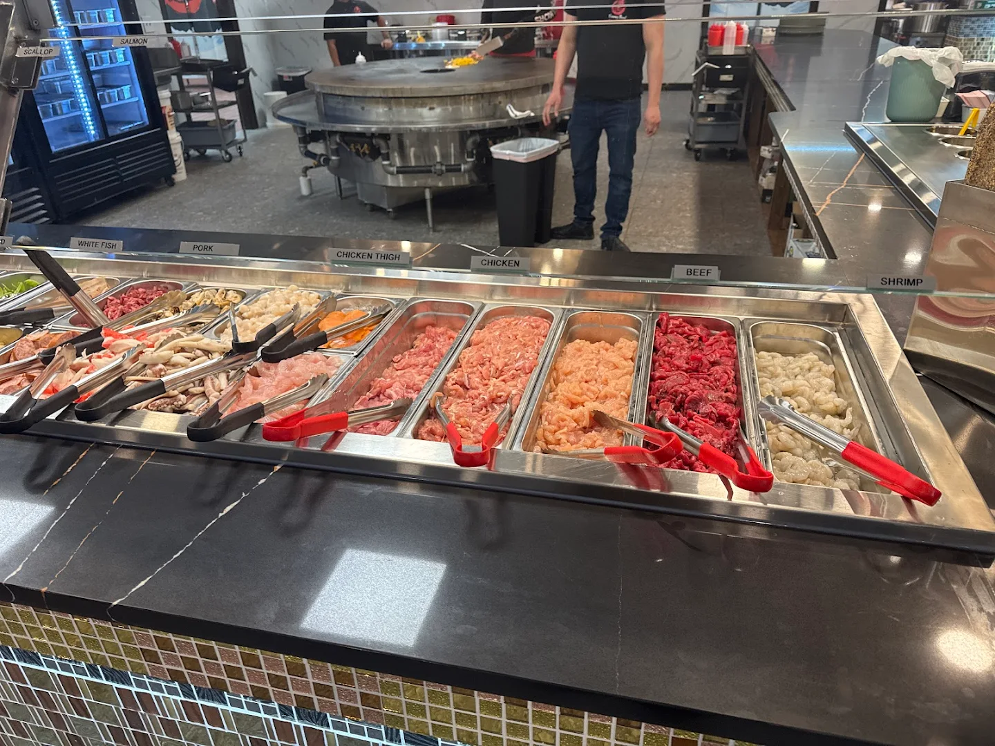 Fresh meat selection bar at Yummy Bowl
